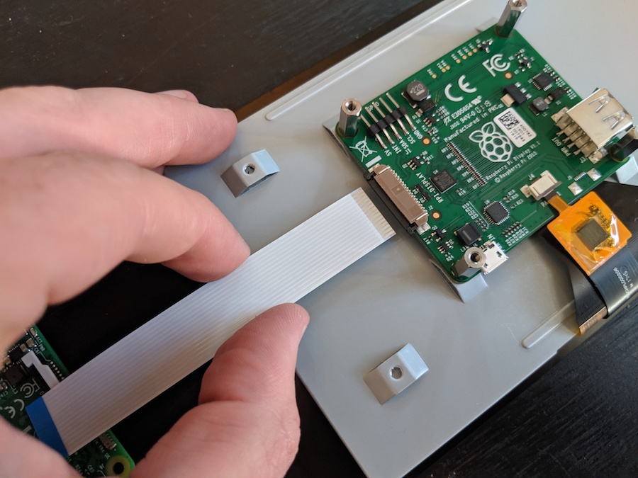 Inserting the ribbon cable into the Raspberry Pi touchscreen