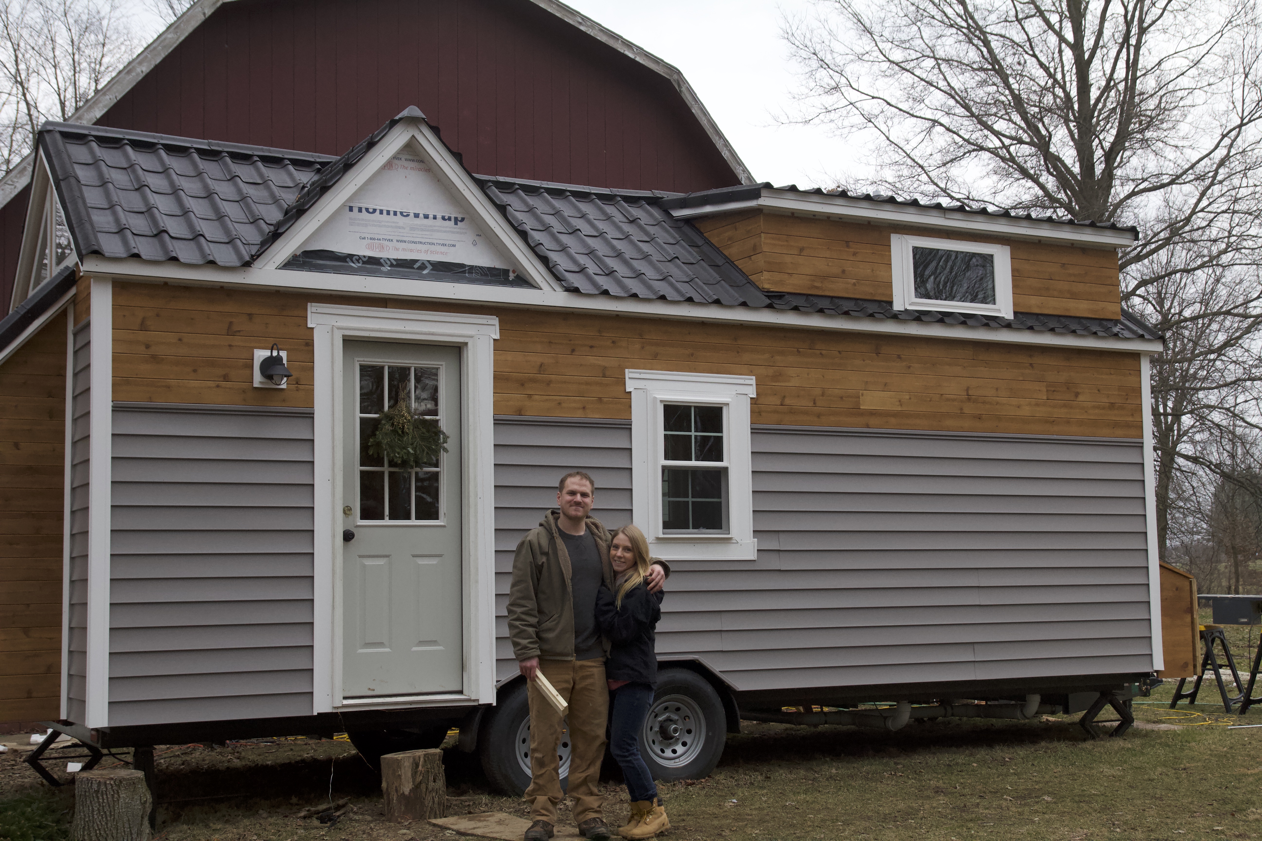 Amy and I outside the Tiny House with siding done